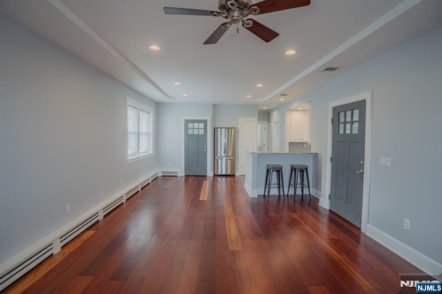 42 Berton Pl, Nutley, NJ 07110 - unfurnished living room with a baseboard heating unit, dark wood-style floors, a ceiling fan, recessed lighting, and baseboards
