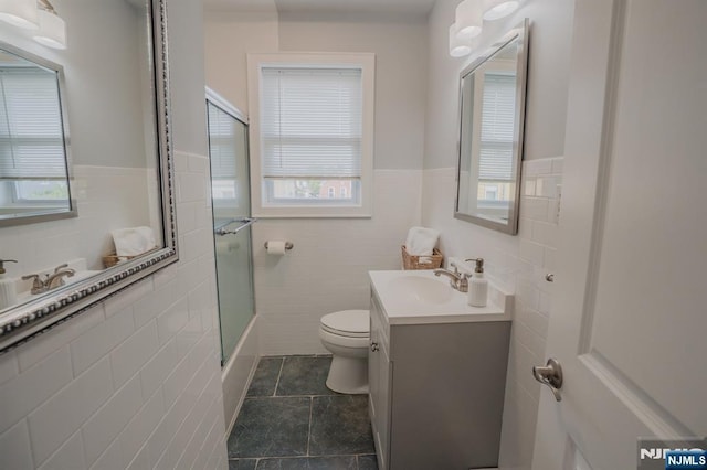 42 Berton Pl, Nutley, NJ 07110 - full bath with tile walls, toilet, healthy amount of natural light, a wainscoted wall, and vanity