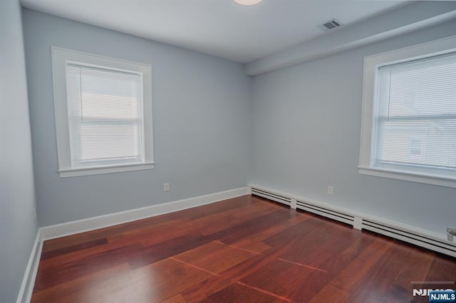 42 Berton Pl, Nutley, NJ 07110 - unfurnished room featuring baseboard heating, wood finished floors, and baseboards