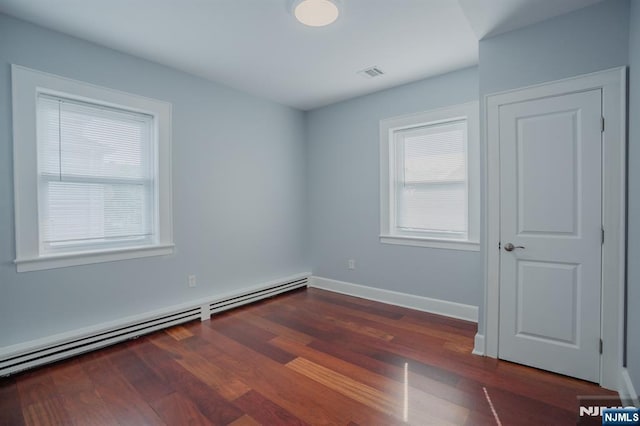 42 Berton Pl, Nutley, NJ 07110 - unfurnished room with a baseboard radiator, dark wood-style floors, and baseboards