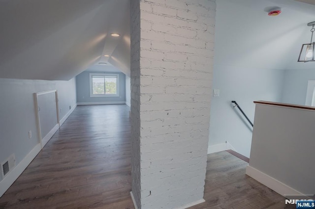 42 Berton Pl, Nutley, NJ 07110 - bonus room featuring lofted ceiling, dark wood-type flooring, and baseboards
