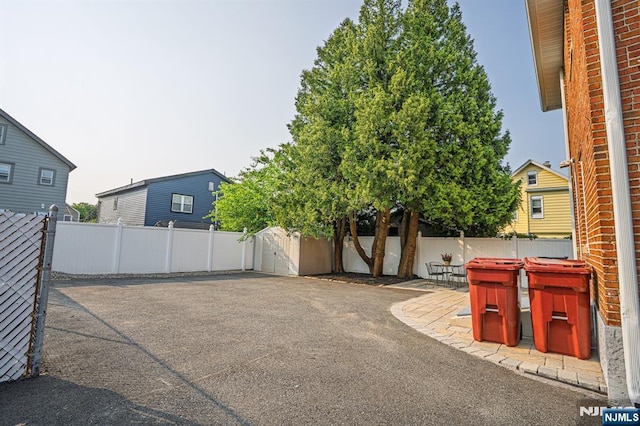 42 Berton Pl, Nutley, NJ 07110 - view of front facade featuring a fenced backyard and a patio area