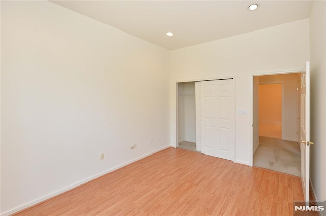 103 Four Seasons Unit 103, Wayne, NJ 07470 - unfurnished bedroom featuring light wood-style floors, baseboards, recessed lighting, and a closet