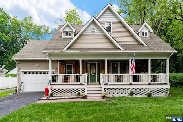 13 Brandt Ln, Bloomingdale, NJ 07403 - view of front of property featuring covered porch, asphalt driveway, a garage, and a shingled roof