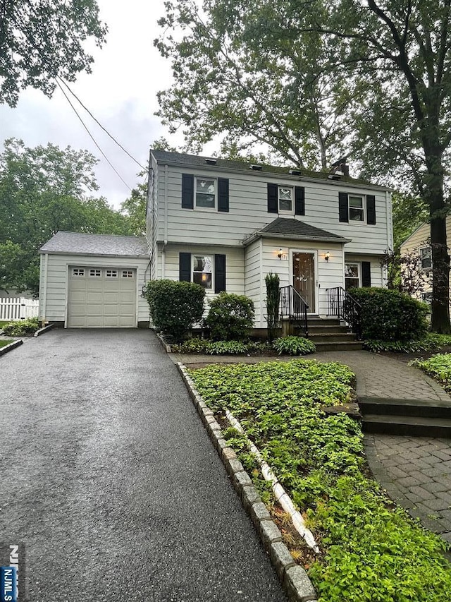 771 Stelton St, Teaneck, NJ 07666 - view of front of home with driveway and an attached garage