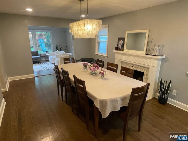771 Stelton St, Teaneck, NJ 07666 - dining space with dark wood-style floors, a chandelier, recessed lighting, and a fireplace