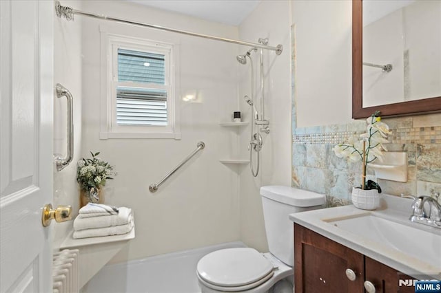 82 Elston St, Bloomfield, NJ 07003 - full bathroom featuring toilet, vanity, a shower, radiator heating unit, and decorative backsplash