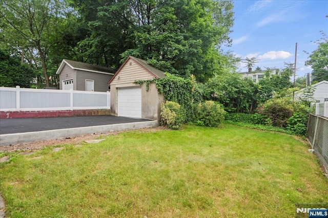 82 Elston St, Bloomfield, NJ 07003 - view of yard with an outdoor structure and a garage