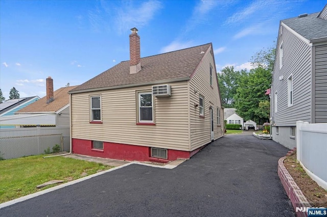 82 Elston St, Bloomfield, NJ 07003 - view of home's exterior with a chimney and roof with shingles