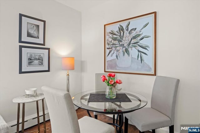 82 Elston St, Bloomfield, NJ 07003 - dining area featuring baseboard heating, wood finished floors, and baseboards