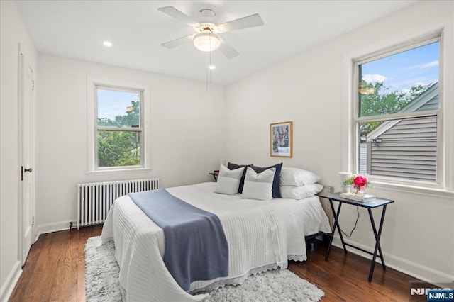 82 Elston St, Bloomfield, NJ 07003 - bedroom with radiator, baseboards, multiple windows, wood finished floors, and recessed lighting
