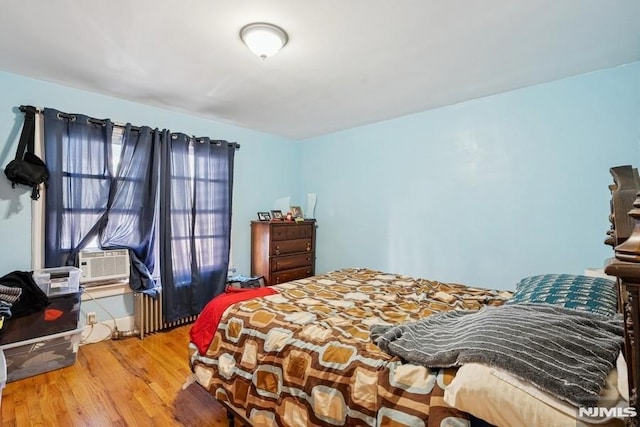 361/2 Hecker St, Newark, NJ 07103 - bedroom with wood finished floors and cooling unit