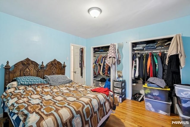 361/2 Hecker St, Newark, NJ 07103 - bedroom featuring multiple closets and wood finished floors