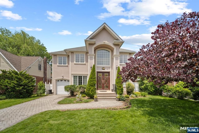 36-15 Garden View Ter, Fair Lawn, NJ 07410 - view of front of home featuring stucco siding, decorative driveway, a front lawn, a garage, and french doors