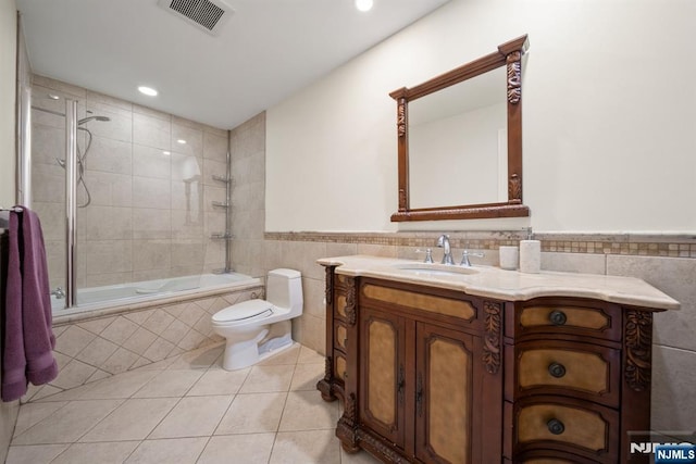 36-15 Garden View Ter, Fair Lawn, NJ 07410 - full bathroom with tile walls, tile patterned floors, tiled shower / bath, vanity, and recessed lighting