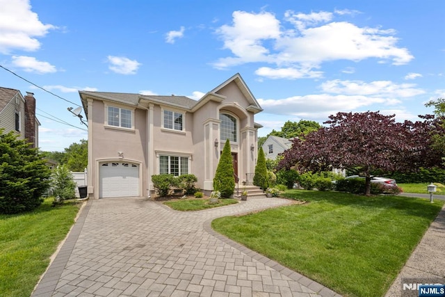 36-15 Garden View Ter, Fair Lawn, NJ 07410 - mediterranean / spanish-style house with stucco siding, a front yard, decorative driveway, and a garage