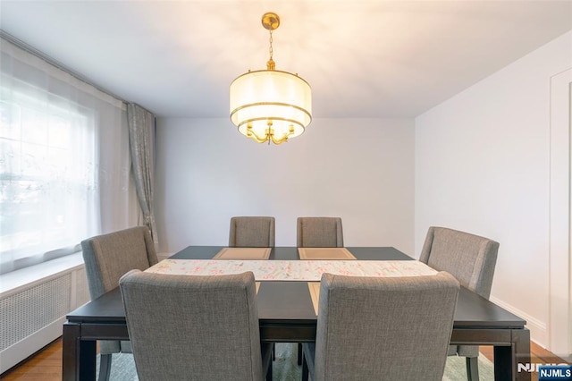 85 Paulin Blvd, Leonia, NJ 07605 - dining area with radiator, wood finished floors, and a chandelier
