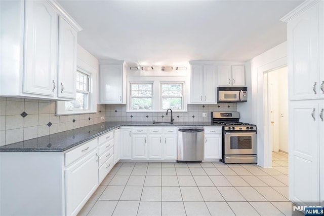 85 Paulin Blvd, Leonia, NJ 07605 - kitchen with stainless steel appliances, a sink, and white cabinetry