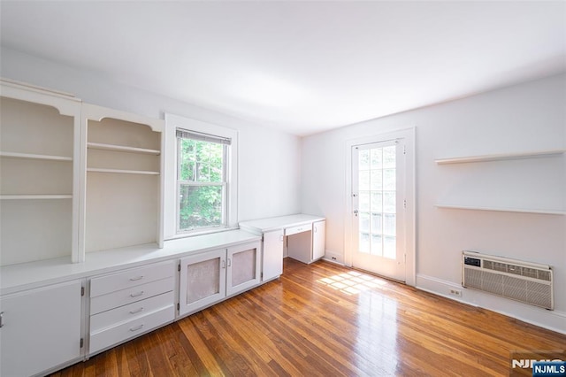 85 Paulin Blvd, Leonia, NJ 07605 - unfurnished office featuring wood finished floors, an AC wall unit, and built in study area