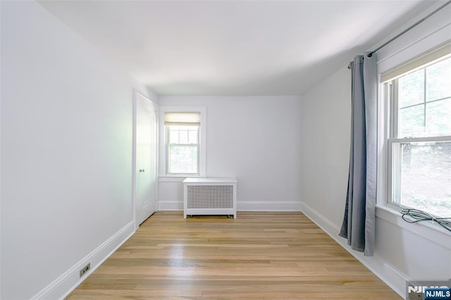 85 Paulin Blvd, Leonia, NJ 07605 - unfurnished room with radiator, light wood-style flooring, and baseboards