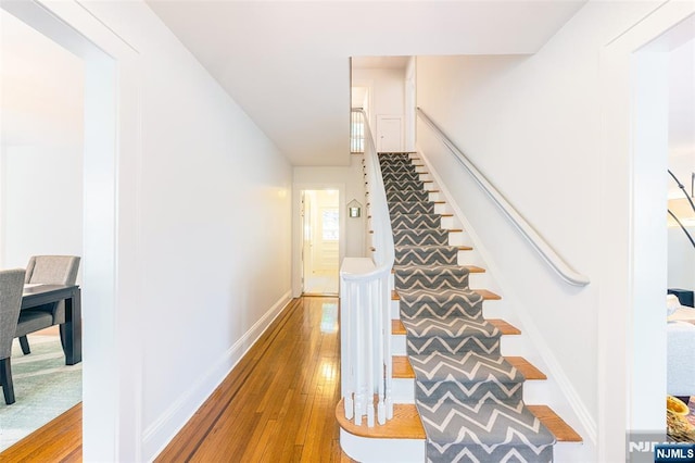 85 Paulin Blvd, Leonia, NJ 07605 - stairs with hardwood / wood-style flooring and baseboards