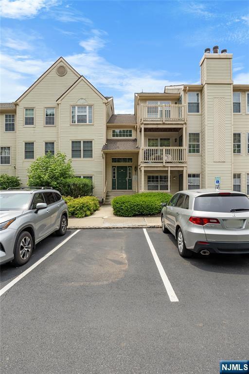 35 Spruce Ct Unit 116, Clifton, NJ 07014 - view of building exterior with uncovered parking
