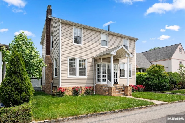 3 Drury Ln, Fort Lee, NJ 07024 - traditional-style house with a chimney, entry steps, and a front yard