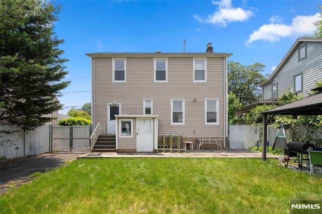 3 Drury Ln, Fort Lee, NJ 07024 - back of property featuring a gate, a gazebo, and a chimney