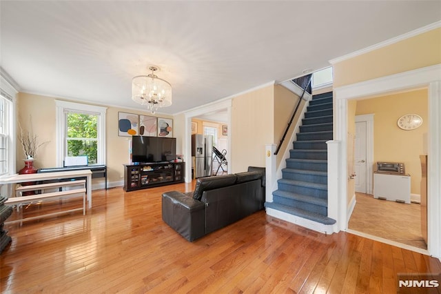3 Drury Ln, Fort Lee, NJ 07024 - living area featuring ornamental molding, light wood-type flooring, stairway, a chandelier, and baseboards