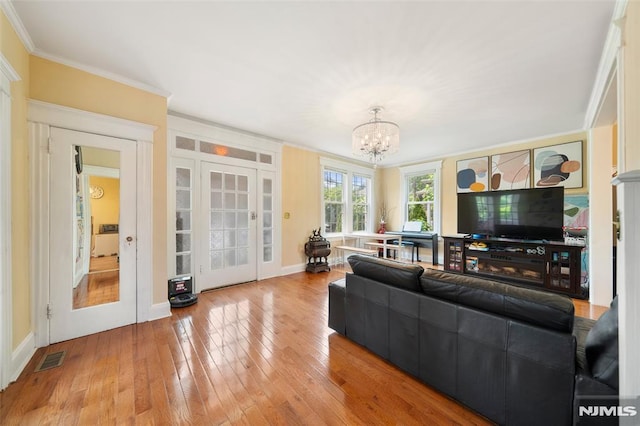 3 Drury Ln, Fort Lee, NJ 07024 - living area featuring a chandelier, french doors, wood-type flooring, ornamental molding, and baseboards