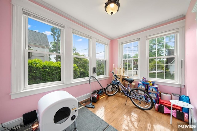 3 Drury Ln, Fort Lee, NJ 07024 - workout area featuring plenty of natural light, hardwood / wood-style flooring, baseboards, and crown molding