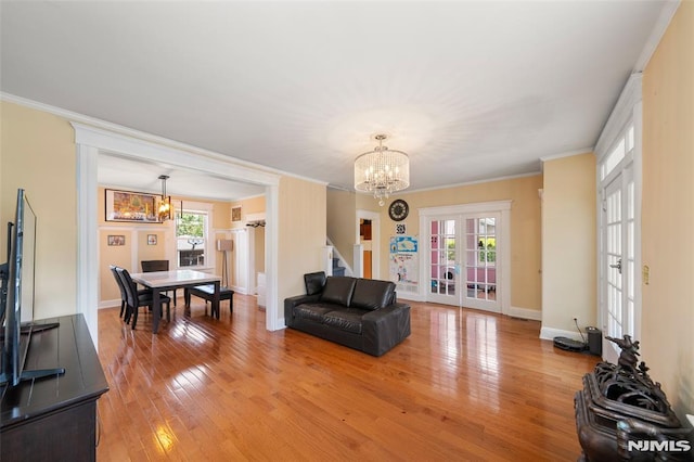 3 Drury Ln, Fort Lee, NJ 07024 - living room featuring a chandelier, french doors, light wood-style floors, and crown molding
