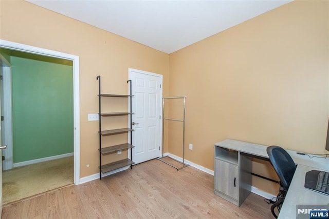 129 Eisenhower Ln Unit 2109, Wood Ridge, NJ 07075 - office area with light wood-style floors and baseboards