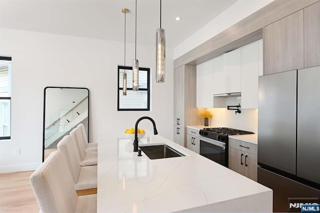 262 Webster Ave Unit 2, Jersey City, NJ 07307 - kitchen featuring stainless steel refrigerator, black gas stove, modern cabinets, white cabinets, and recessed lighting