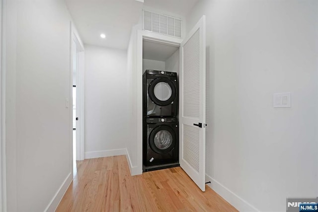 262 Webster Ave Unit 2, Jersey City, NJ 07307 - laundry area with stacked washer and clothes dryer and light wood-style flooring