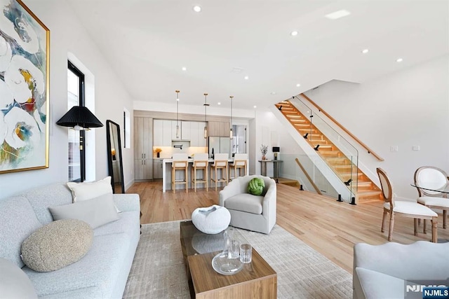 262 Webster Ave Unit 2, Jersey City, NJ 07307 - living room with stairs, recessed lighting, and light wood-style floors