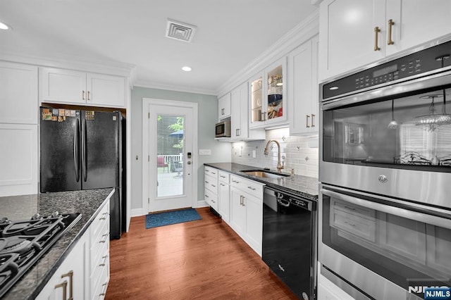 39 N 5th St, Park Ridge, NJ 07656 - kitchen featuring black appliances, crown molding, white cabinets, tasteful backsplash, and glass insert cabinets
