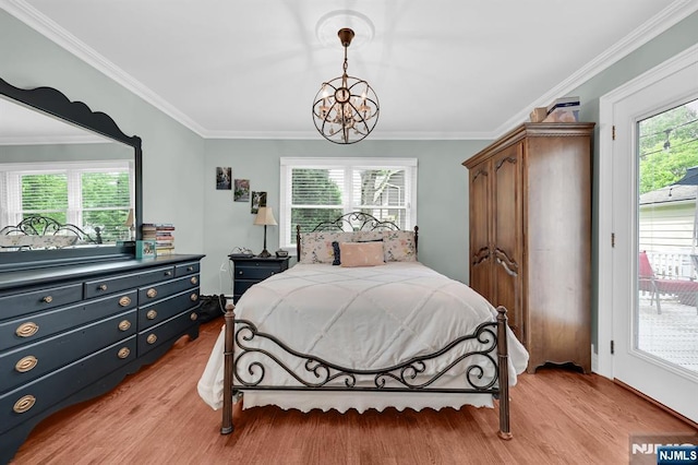 39 N 5th St, Park Ridge, NJ 07656 - bedroom featuring a chandelier, light wood-style flooring, ornamental molding, and access to exterior