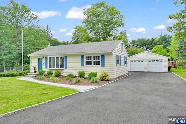 39 N 5th St, Park Ridge, NJ 07656 - view of front of property with a detached garage, an outbuilding, and roof with shingles