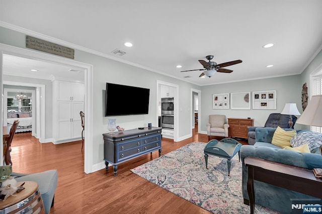 39 N 5th St, Park Ridge, NJ 07656 - living area with recessed lighting, wood finished floors, a ceiling fan, and crown molding