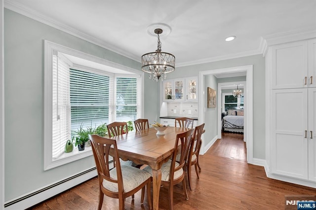 39 N 5th St, Park Ridge, NJ 07656 - dining room featuring a chandelier, a baseboard radiator, plenty of natural light, crown molding, and wood finished floors