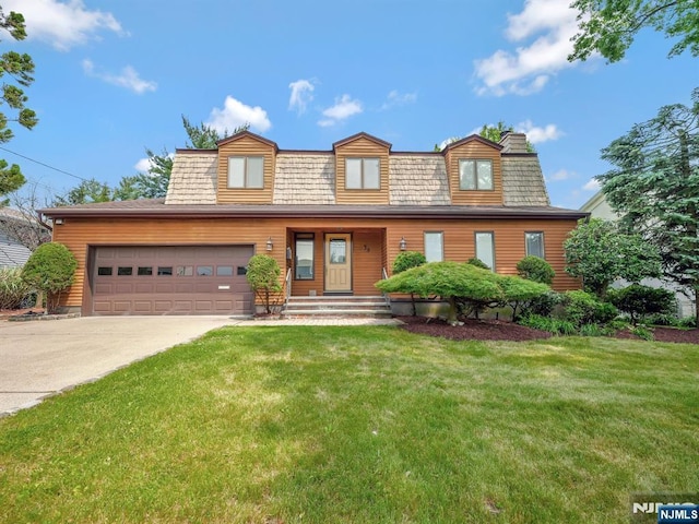 39 Daniels Dr, Clifton, NJ 07013 - view of front of home featuring an attached garage, concrete driveway, and a front yard