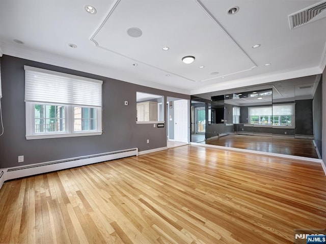 39 Daniels Dr, Clifton, NJ 07013 - unfurnished living room featuring wood finished floors, a baseboard heating unit, plenty of natural light, and baseboards
