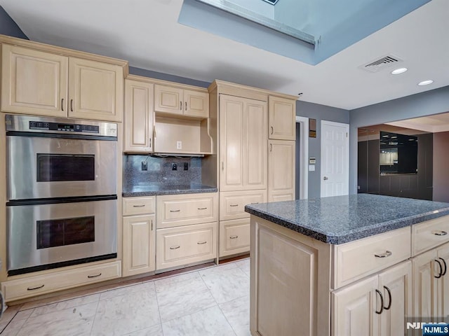 39 Daniels Dr, Clifton, NJ 07013 - kitchen featuring double oven, light marble finish floors, tasteful backsplash, recessed lighting, and a kitchen island