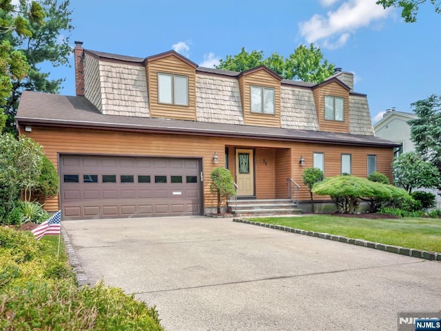 39 Daniels Dr, Clifton, NJ 07013 - view of front of property with a chimney, driveway, and a front yard