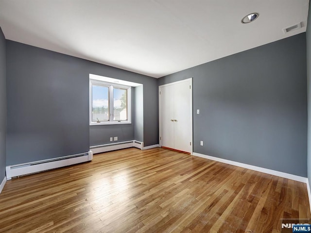 39 Daniels Dr, Clifton, NJ 07013 - unfurnished room featuring wood finished floors, a baseboard radiator, and baseboards