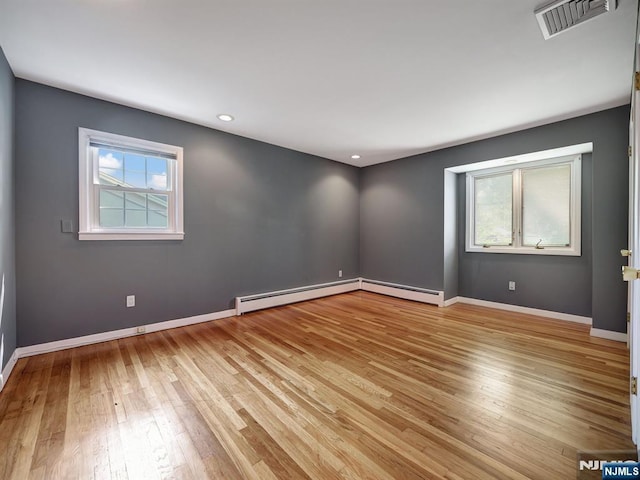 39 Daniels Dr, Clifton, NJ 07013 - unfurnished room with a baseboard radiator, plenty of natural light, hardwood / wood-style flooring, and recessed lighting