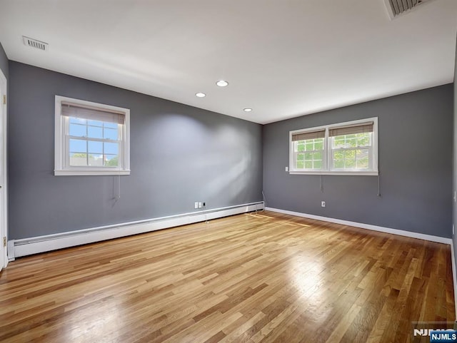 39 Daniels Dr, Clifton, NJ 07013 - spare room with baseboard heating, wood finished floors, recessed lighting, and baseboards