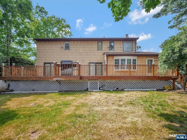 39 Daniels Dr, Clifton, NJ 07013 - back of property featuring a yard, a wooden deck, and a chimney
