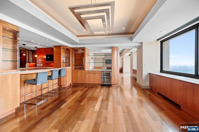 200 Old Palisade Unit Ph4/5, Fort Lee, NJ 07024 - bar with wine cooler, a raised ceiling, light wood-type flooring, and double oven